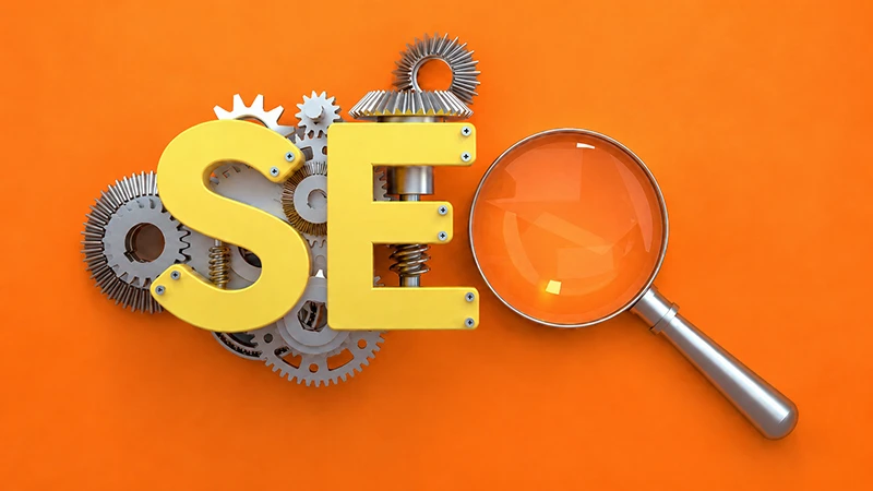 Dişli çarklar ve büyüteçle oluşturulmuş SEO harfleri
